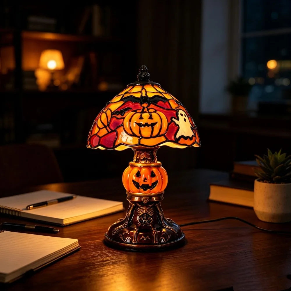 Halloween Tiffany-style lamp glowing on a desk
